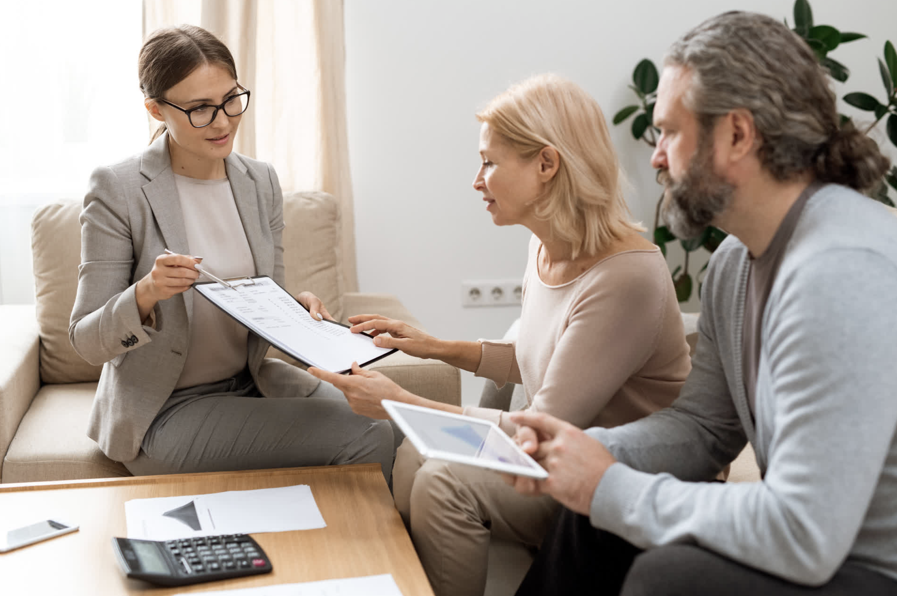 Real estate agent educating clients about buying a home with student loans